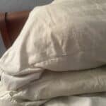 two pillows on a bed setup
