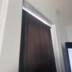 a doorway blackout curtain in bedroom setup