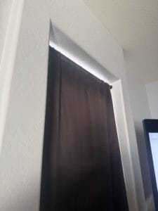 a doorway blackout curtain in bedroom setup