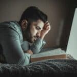 a guy reading before bed