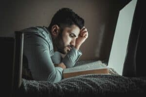 a guy reading before bed