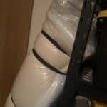 a mattress in storage bag in garage