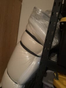 a mattress in storage bag in garage