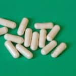 pills grouped together green background