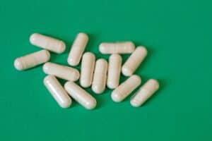 pills grouped together green background
