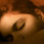 a woman sleeping in daytime
