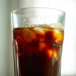 ice and soda in a clear cup