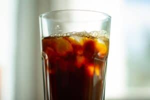 ice and soda in a clear cup