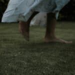 someone walking outdoors in gown