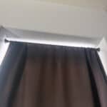 a tension rod holding up blackout curtain