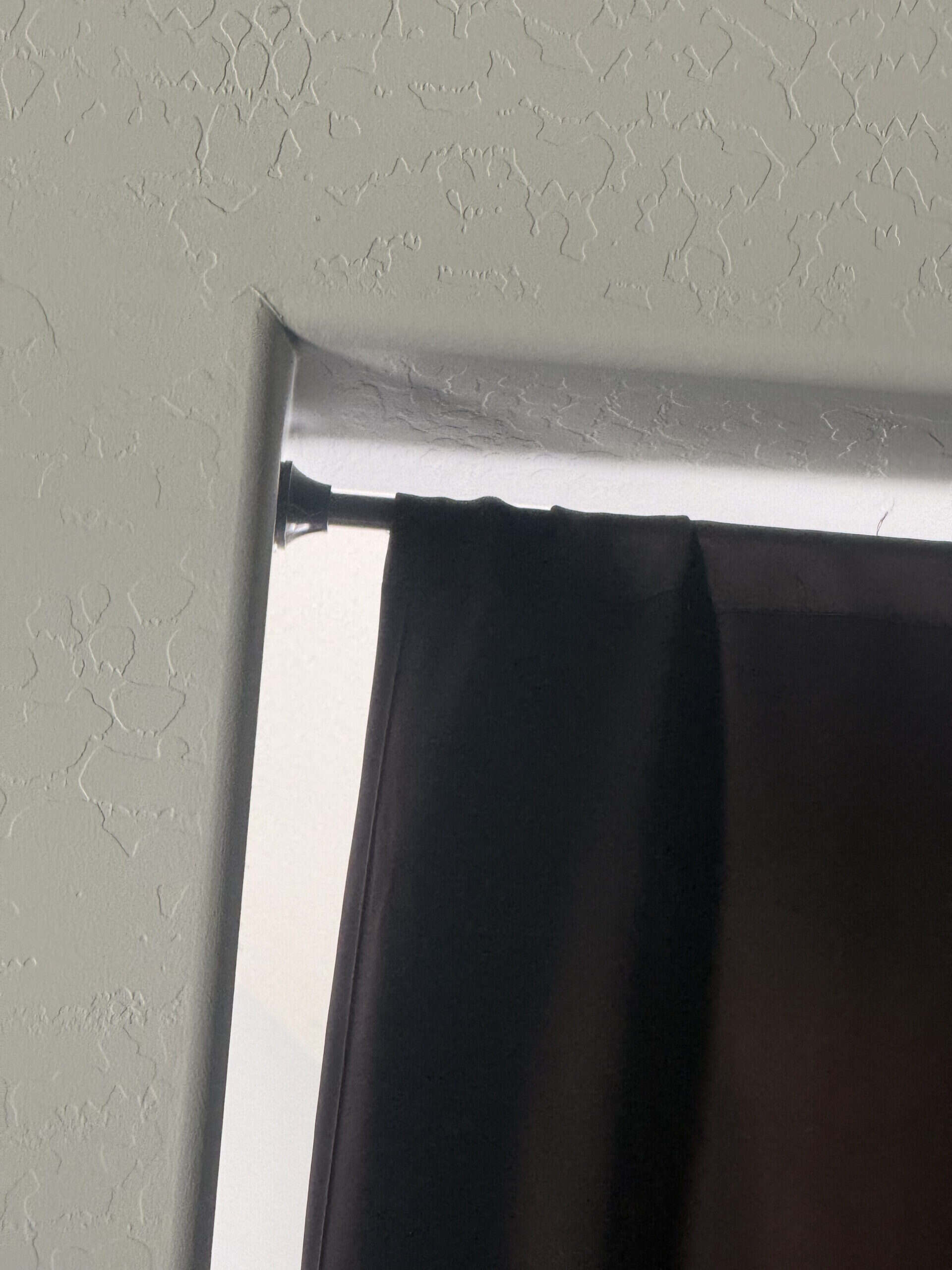 Will a Tension Rod Damage Painted Drywall: What the Pressure Actually Does to a Wall